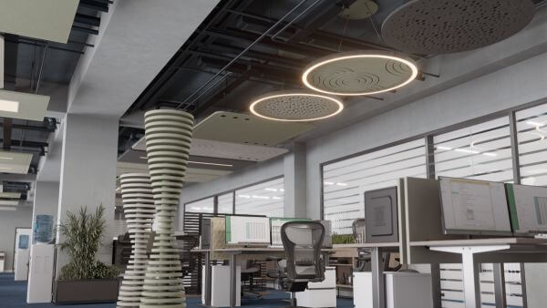 Das Bild zeigt ein modernes Büro mit mehreren Arbeitsplätzen, Computern, und trennenden Elementen sowie runden Deckenelementen und -leuchten.