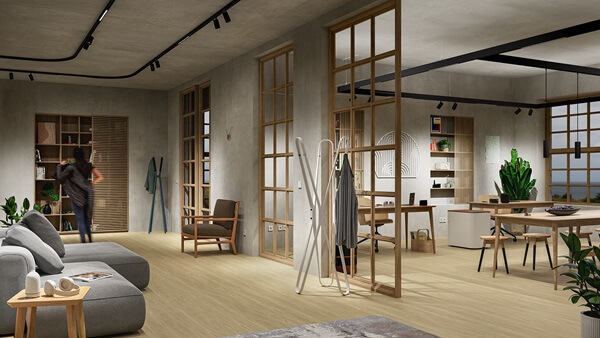TRILUX RAIL Das Bild zeigt einen modernen, gemütlich eingerichteten Arbeits- oder Wohnraum mit offenem Grundriss. Der Raum ist in warmen Naturtönen gehalten und mit Holzelementen gestaltet. Im Vordergrund steht ein graues Sofa mit einem kleinen Holztisch, im Hintergrund befinden sich Arbeitsbereiche mit Tischen, Stühlen und Regalen. Glasrahmen und Holzwände strukturieren den Raum dezent. Eine Person bewegt sich im hinteren Bereich, und zahlreiche Pflanzen sorgen für eine angenehme, wohnliche Atmosphäre.