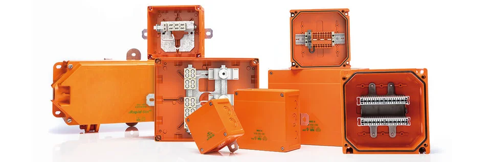 Das Bild zeigt verschiedene Produkte in der Farbe Orange des Herstellers Spelsberg zum elektrischen Funktionserhalt.