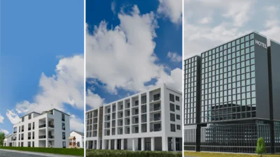 Das Bild zeigt drei moderne Gebäude nebeneinander: links ein mehrstöckiges Wohnhaus, in der Mitte ein größeres Bürogebäude und rechts ein hohes, verglastes Hotel.