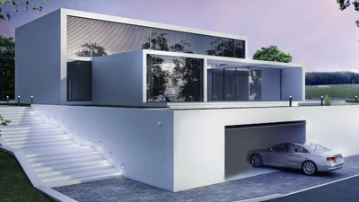 Außenansicht eines modernen Wohnhaus. Es fährt gerade ein Auto in die Garage.